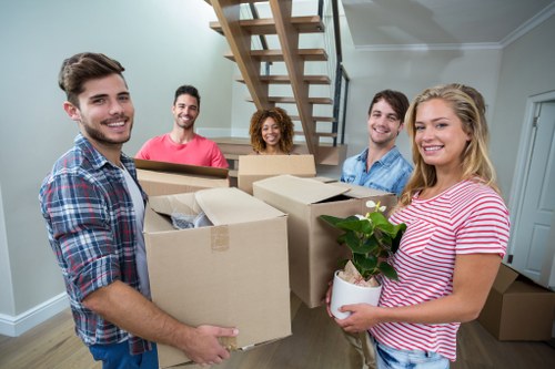 Professional packing team organising boxes for a Sutton home move