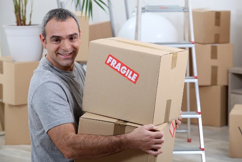 Removal team loading household items for a move in Sutton