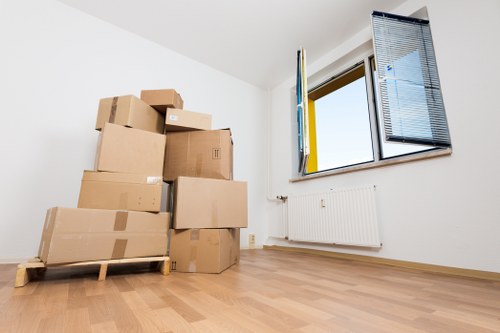 Careful loading of household items into a moving van in Sutton
