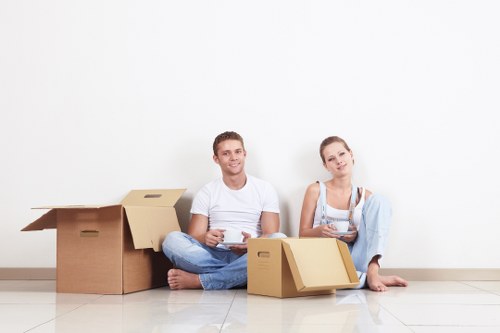 Professional removal crew loading furniture for a Sutton relocation