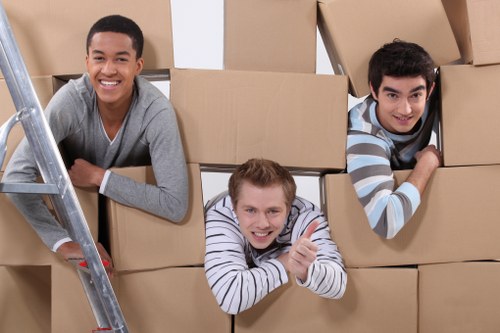 Furniture being loaded carefully into a moving van during an urgent Sutton removal